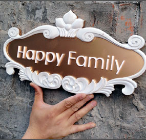 X3M desktop CNC machine engraving a weather-resistant wooden doorplate