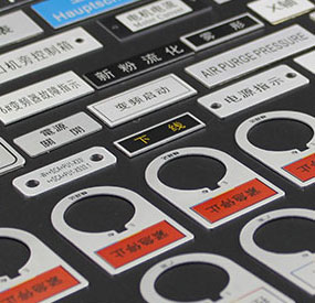 X3-WS compact CNC machine processing an anodized industrial metal nameplate