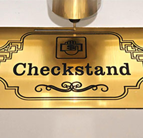 X6M desktop CNC machine engraving a commercial copper nameplate