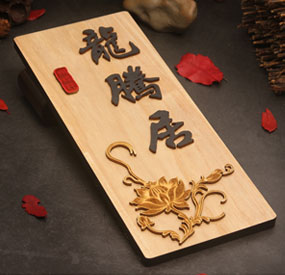 X6M desktop CNC machine machining a wooden commercial sign