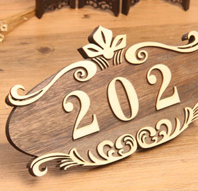 X6M desktop CNC machine machining a wooden commercial sign
