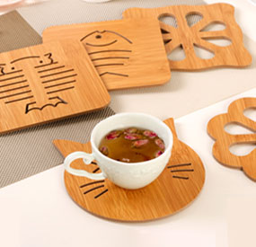 XC-21D compact CNC router cutting round wooden coasters